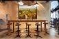 Preview: Restaurant mit einem stimmungsvollen Wandbild mit Weinbergen im Schattenfugenrahmen an der Wand