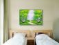 Preview: Ein Schlafzimmer oder Hotel. An der Wand hängt ein schönes Landschsftsgemälde mit Birken