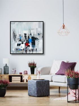Heller Raum. Zur Dekoration ein Bild einer abstrakten Skyline an der Wand