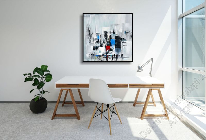 Arbeitszimmer mit einem abstrakten, unaufgeregten Wandbild Skyline im Bilderrahmen