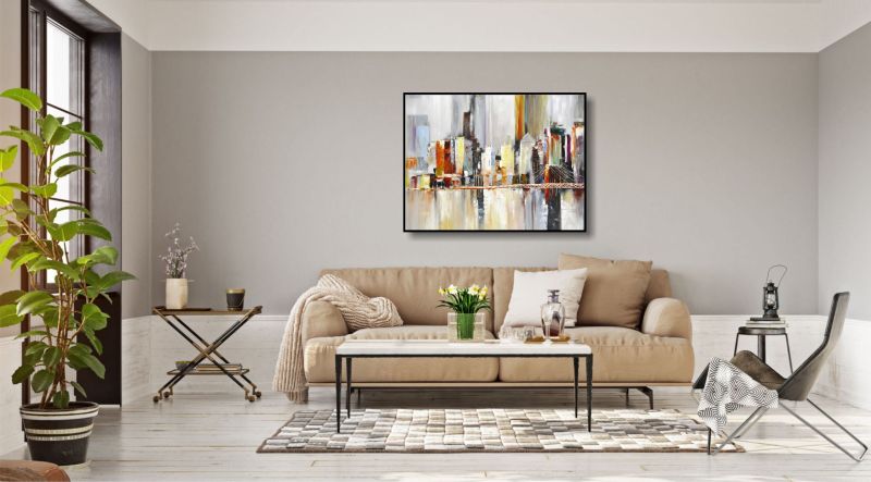 Heller Raum. Zur Dekoration ein Bild einer abstrakten Stadt an der Wand