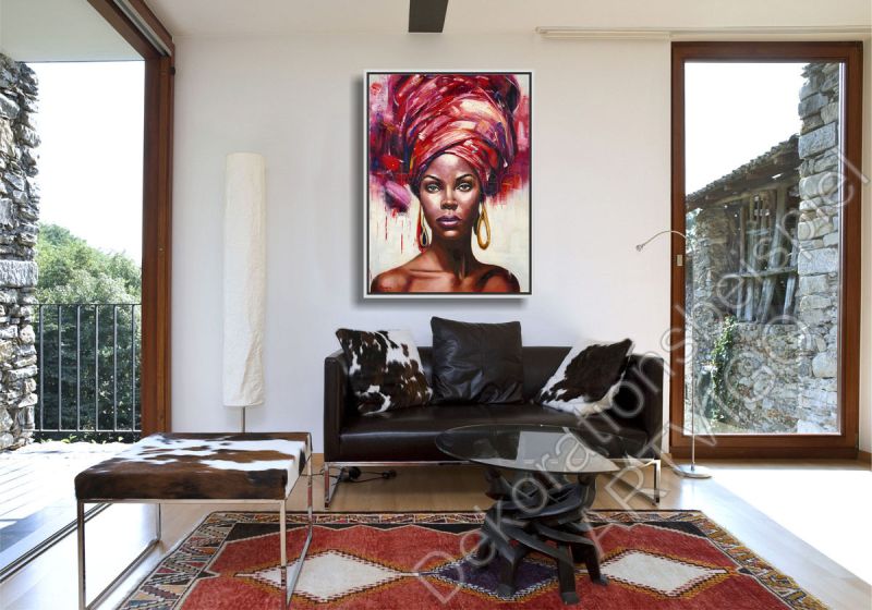 Stylishes Wohnzimmer. Zur Dekoration hängt ein farbenfrohes Portrait