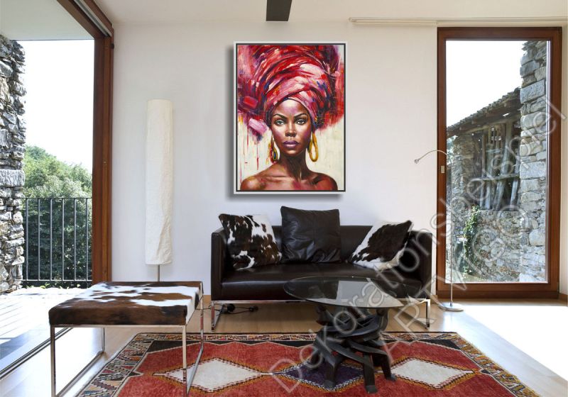 Stylishes Wohnzimmer. Zur Dekoration hängt ein farbenfrohes Portrait
